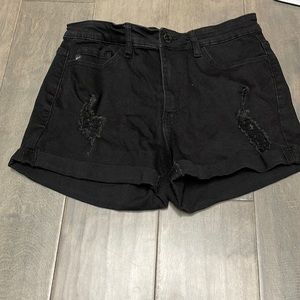 Black, purposely ripped jean shorts, size 11 for juniors.